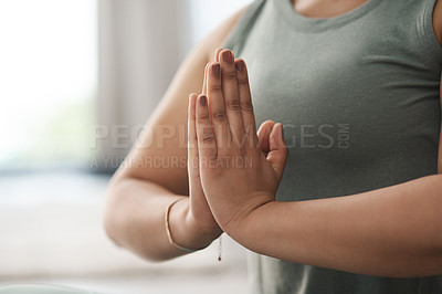 Buy stock photo Closeup shot of an unrecognisable woman meditating at home