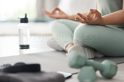 Buy stock photo Closeup shot of an unrecognisable woman meditating at home