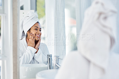 Buy stock photo Shot of a young woman going through her beauty routine at home