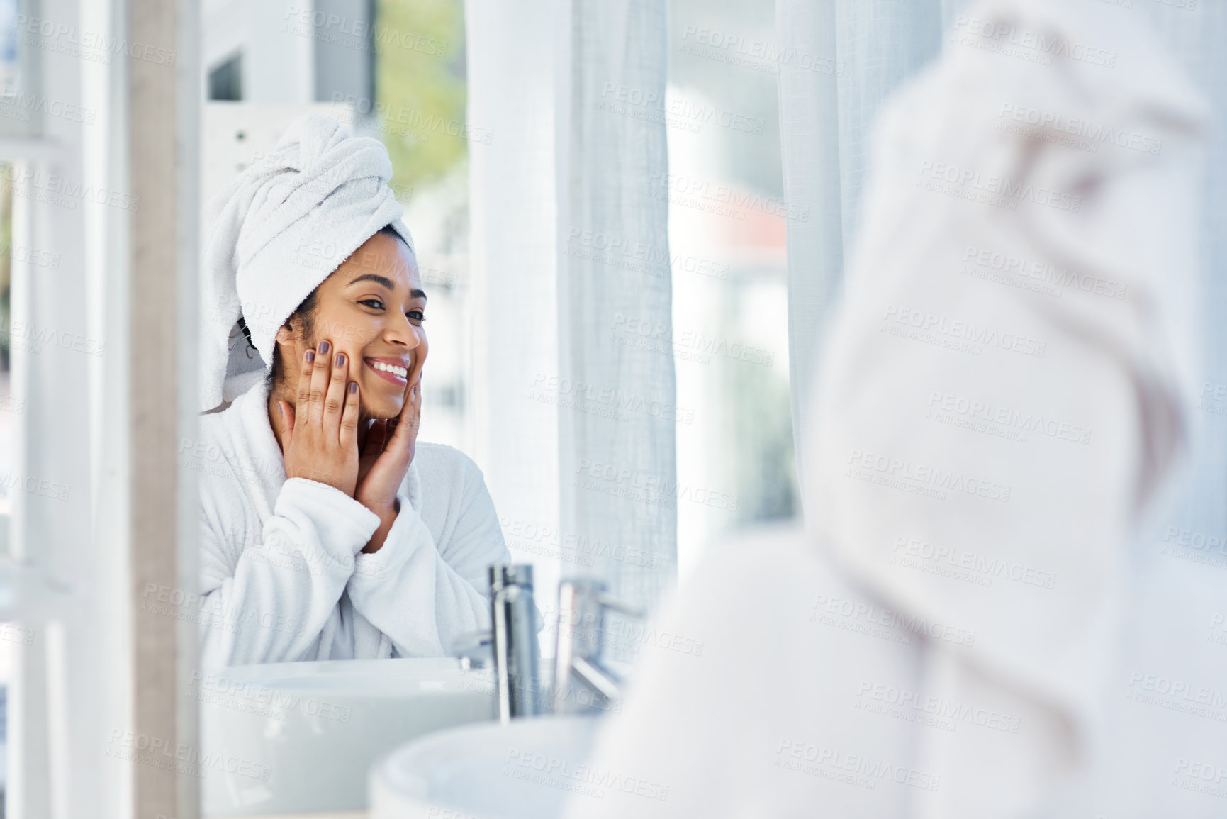 Buy stock photo Shot of a young woman going through her beauty routine at home