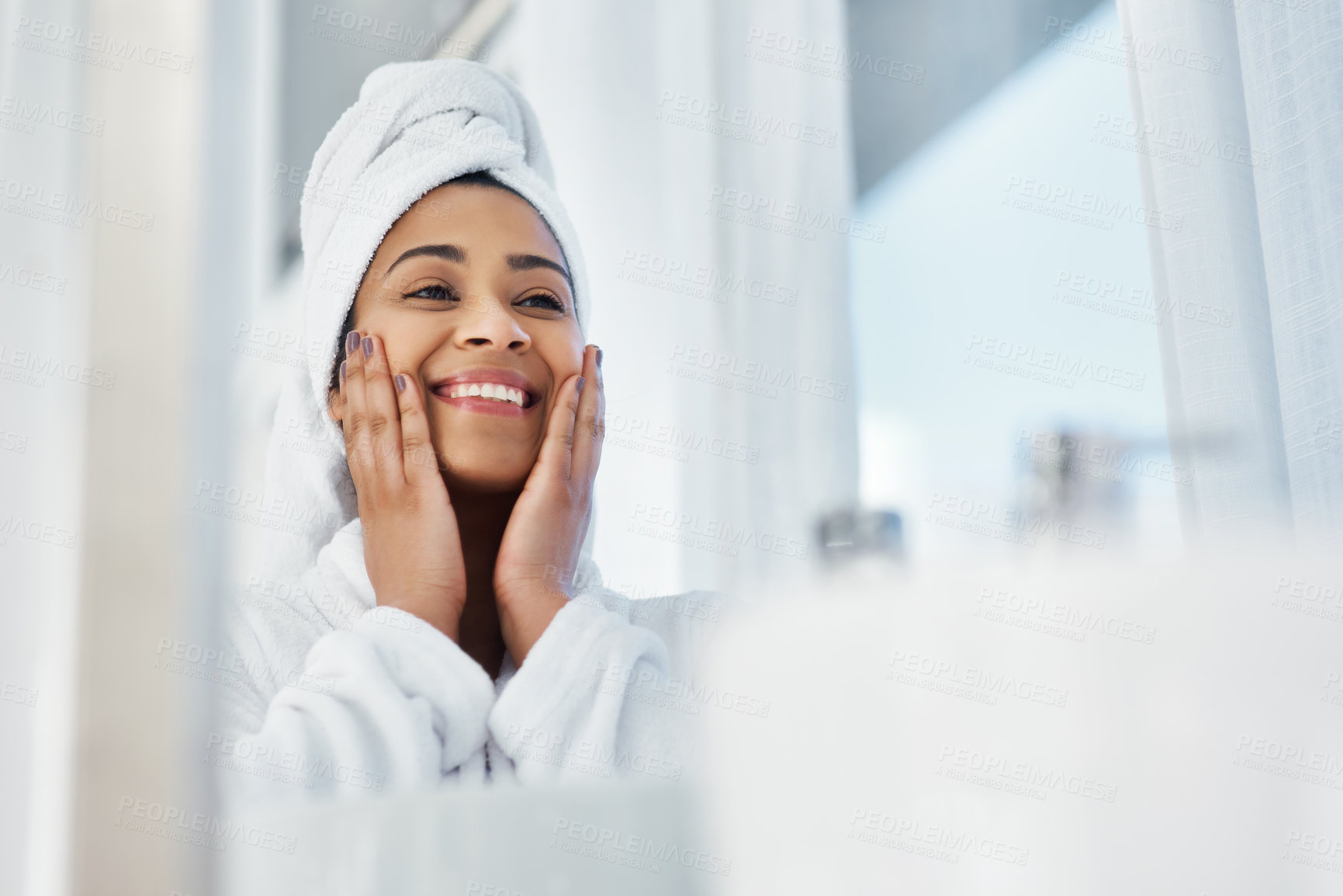 Buy stock photo Shot of a young woman going through her beauty routine at home