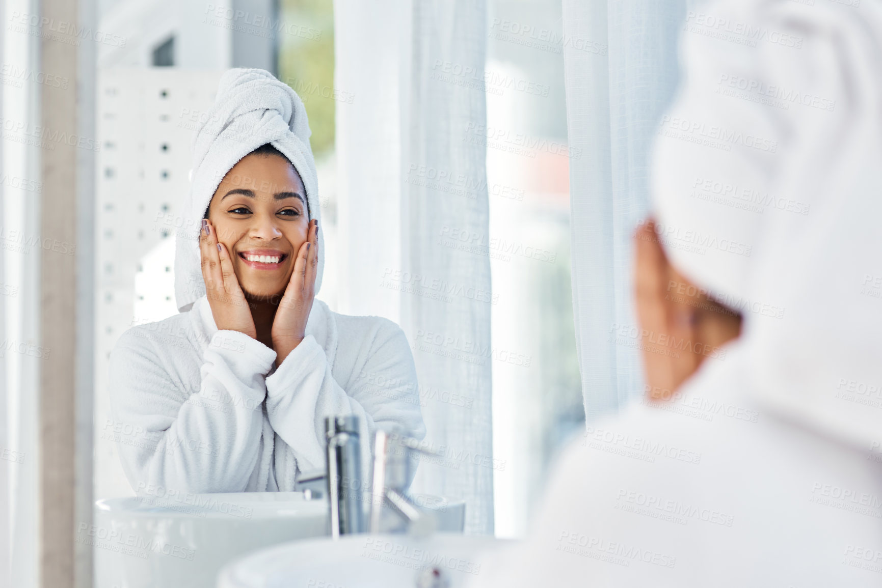 Buy stock photo Shot of a young woman going through her beauty routine at home