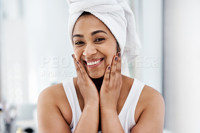 Buy stock photo Shot of a young woman going through her beauty routine at home