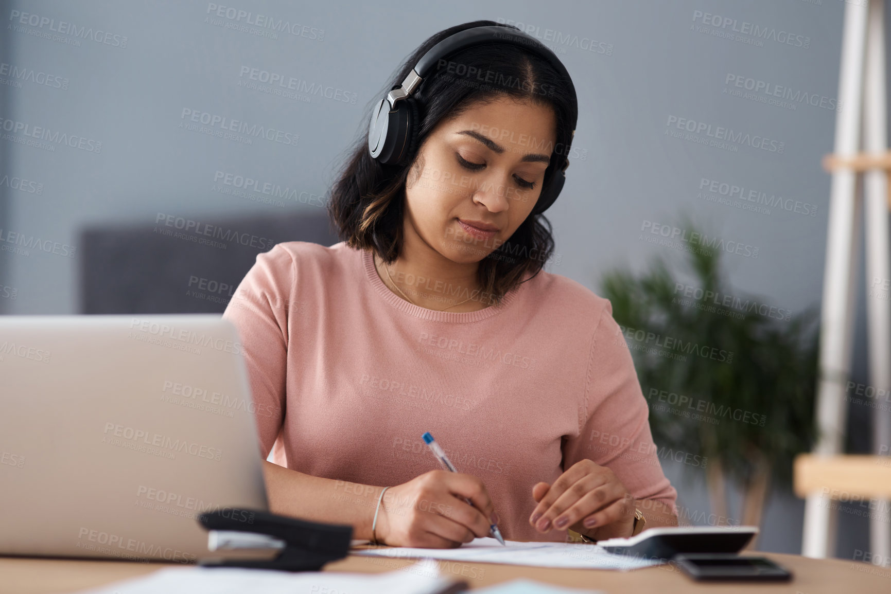 Buy stock photo Shot of a young woman working from home