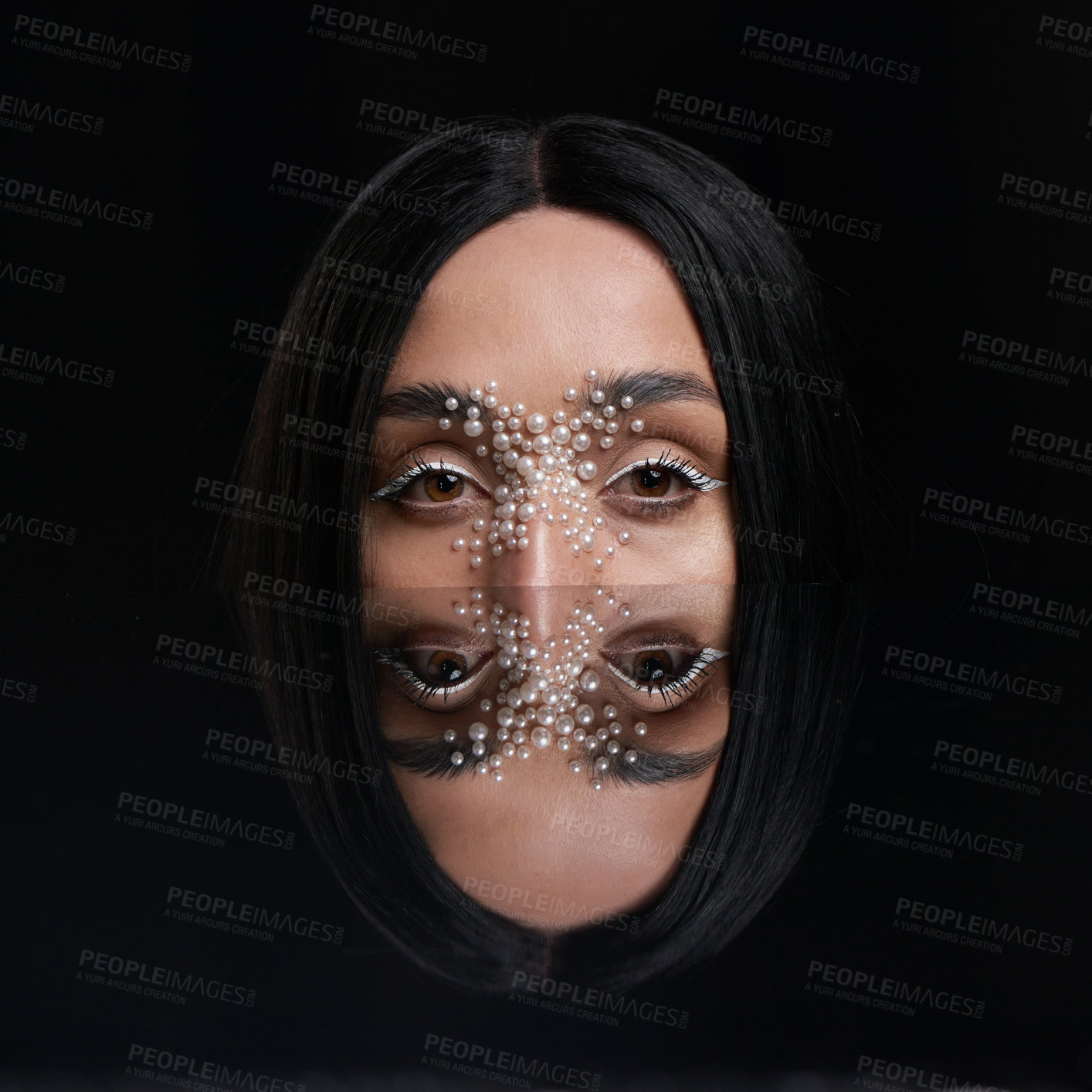 Buy stock photo Studio portrait of a beautiful young woman with pearls on her face posing against a black background