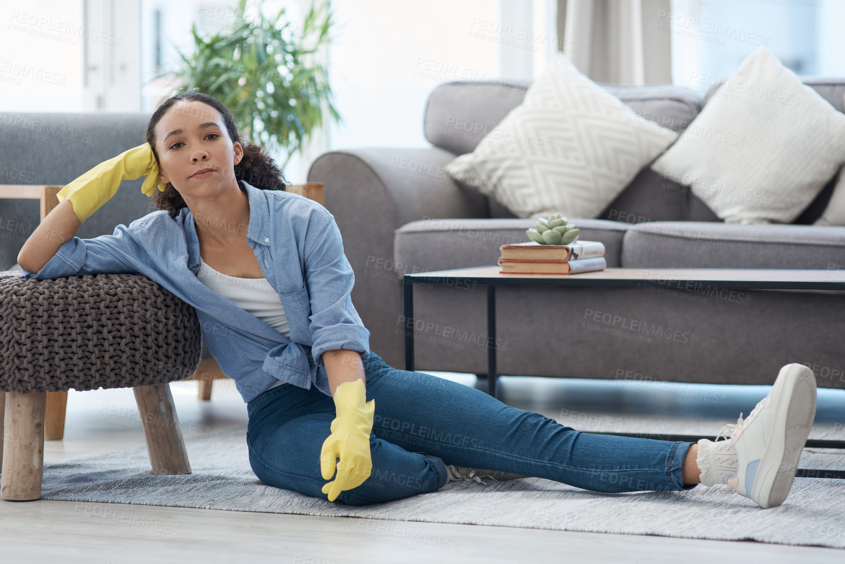 Buy stock photo Woman, portrait and cleaner relax after cleaning living room, housekeeping and tired housekeeper at home. Serious female person on break, clean house with hygiene and gloves for safety from bacteria