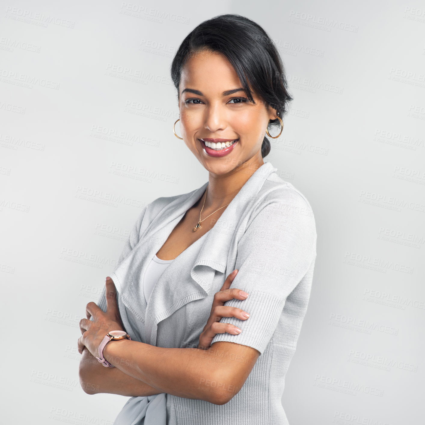 Buy stock photo Studio shot of a confident young businesswoman posing against a grey background