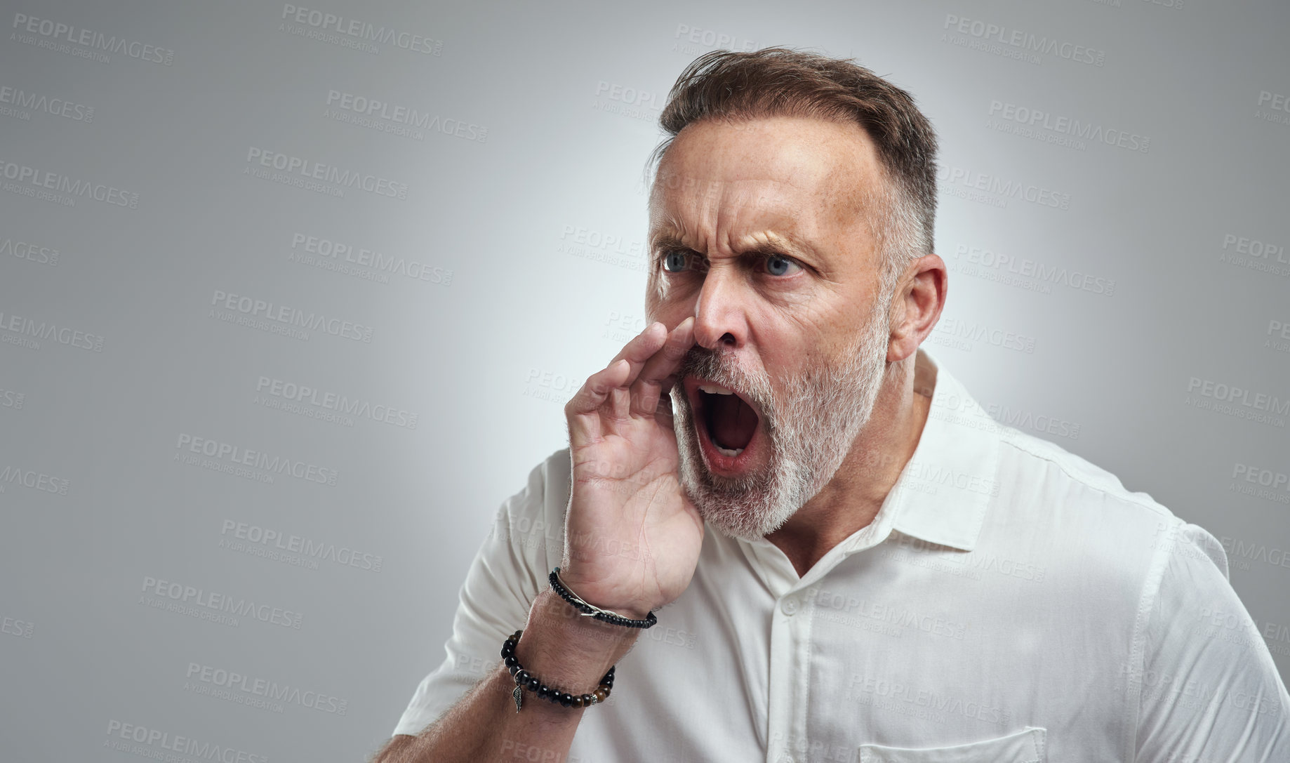 Buy stock photo Studio shot of a mature man yelling against a grey background