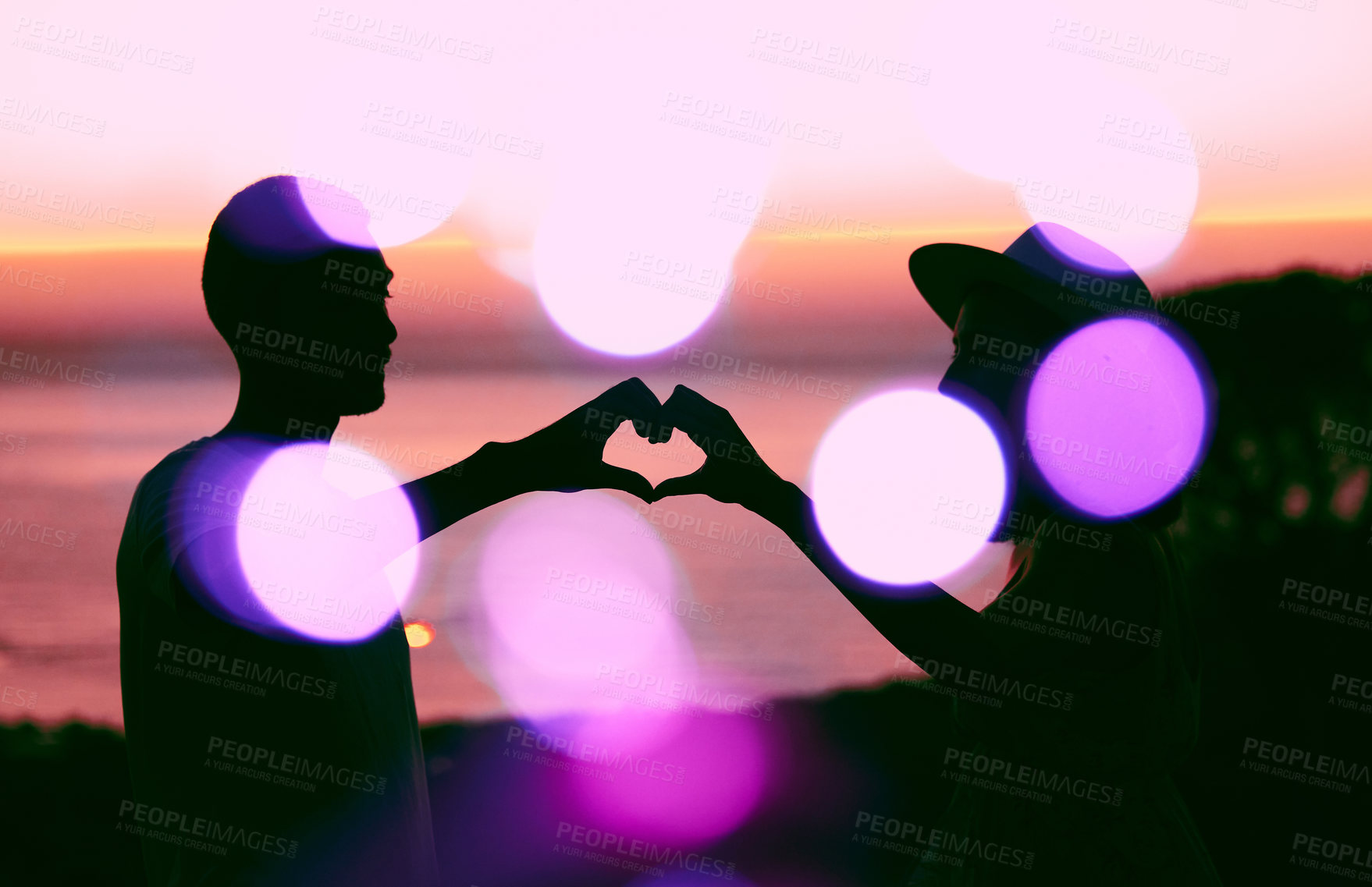 Buy stock photo Sunset sky, bokeh and silhouette of couple with heart hand, emoji and light on romantic outdoor date. Love sign, man and woman with care, affection and relationship support on evening travel holiday.