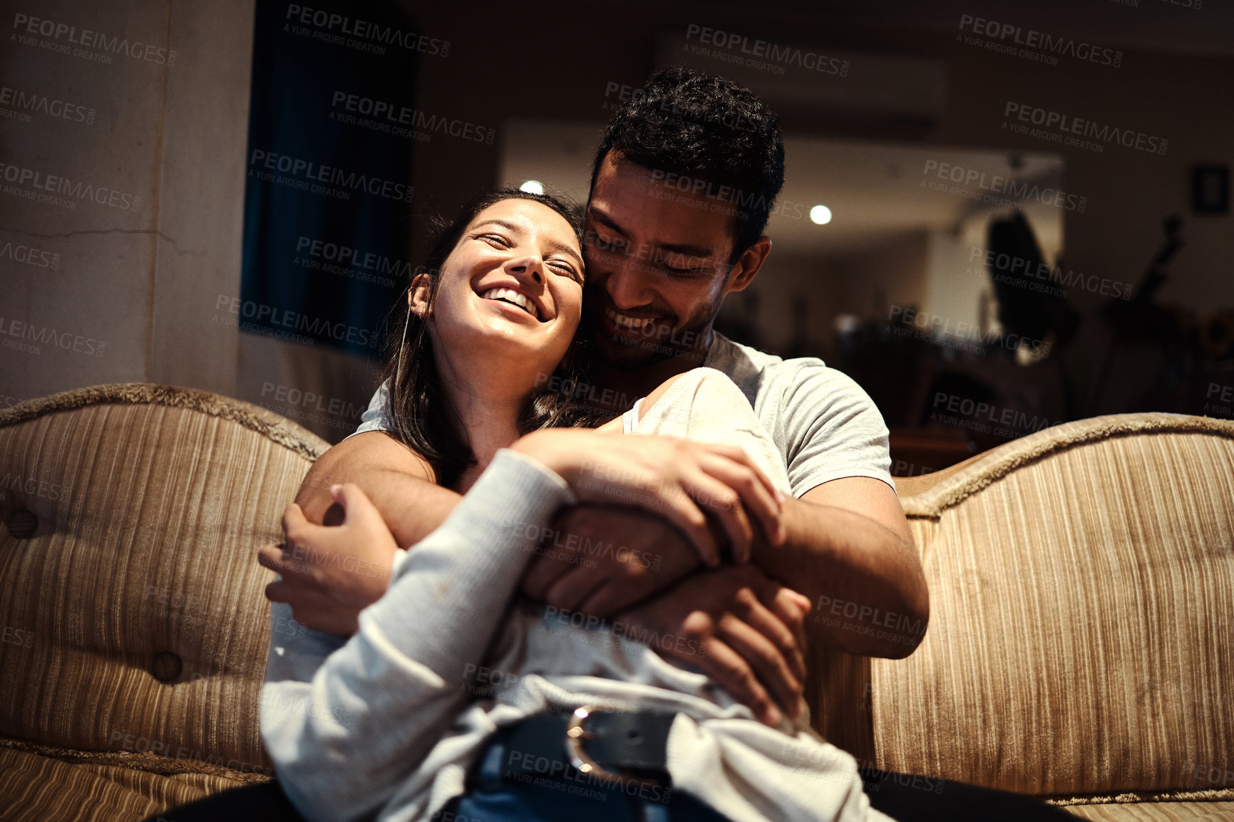 Buy stock photo Shot of an affectionate couple spending quality time together at home