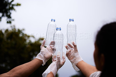 Buy stock photo Plastic recycling, sky bottle and volunteer cleaning garbage, pollution or waste product for environment support. Community help, NGO charity and eco friendly people helping with nature park clean up