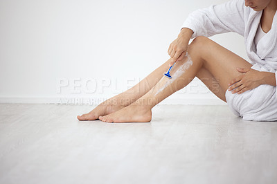 Buy stock photo Home, shaving legs and woman on floor, skincare or wellness with dermatology, cosmetics or grooming routine. Person, closeup or girl with mockup space, hair removal or beauty treatment with self care