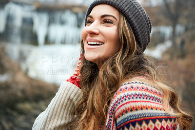 Buy stock photo Cropped shot of an attractive young woman spending the day outside during winter
