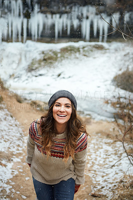 Buy stock photo Cropped portrait of an attractive young woman spending the day outside during winter