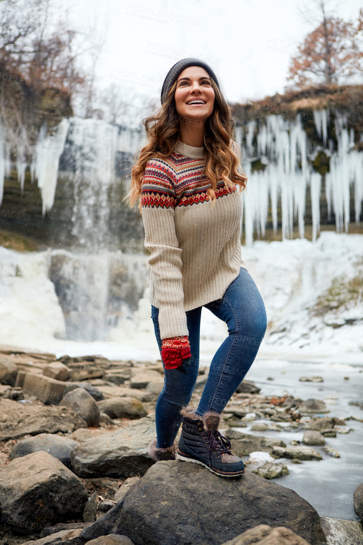 Buy stock photo Full length shot of an attractive young woman spending the day outside during winter