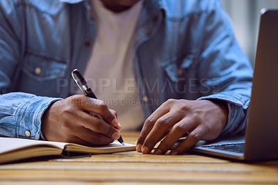 Buy stock photo Man, hands and writing with laptop in book for studying, elearning or education on desk at home. Closeup of male person, student or writer taking notes in diary for reminder, information or agenda