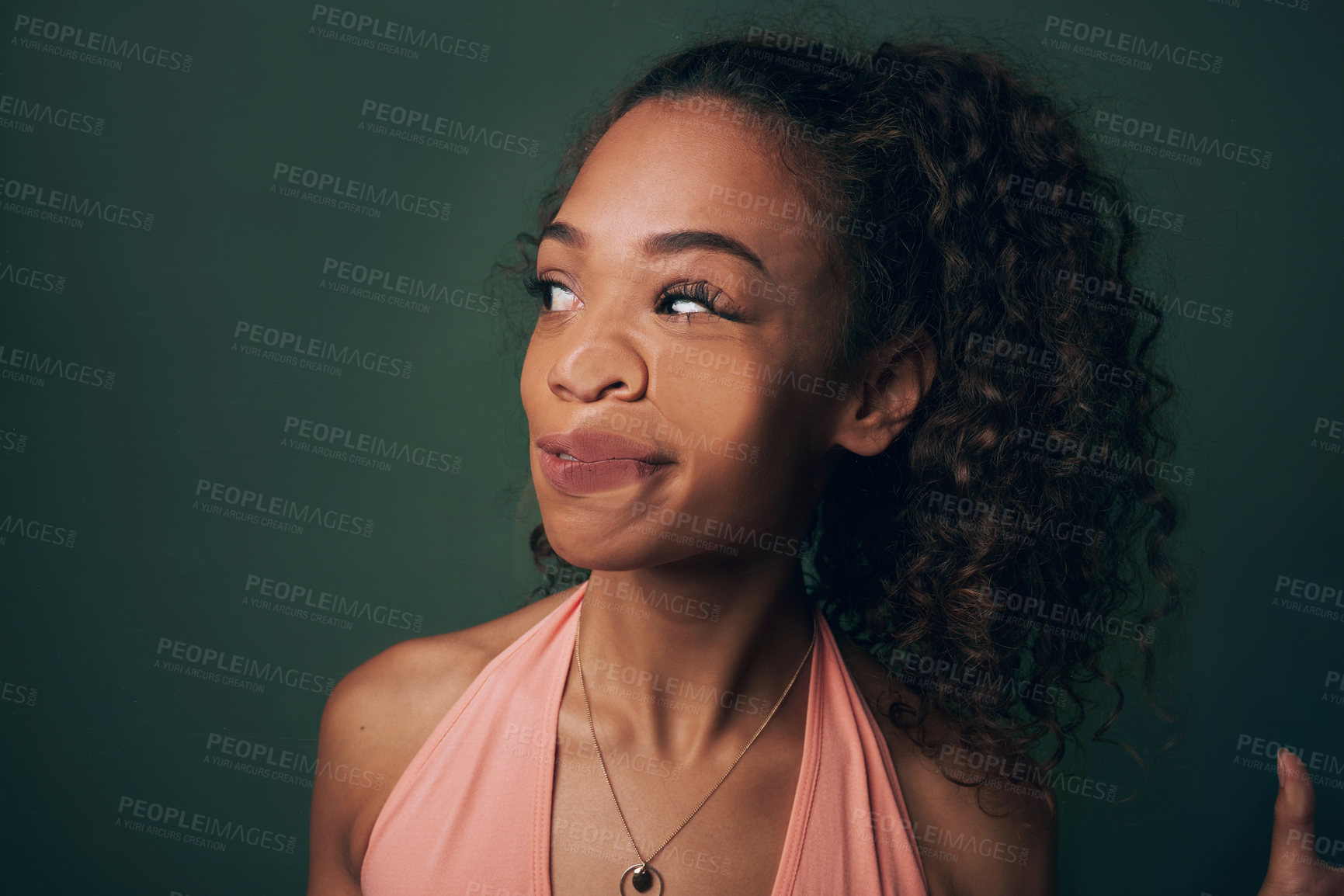 Buy stock photo Woman, face and crush on glass or funny in studio with comic expression, humor or press on transparent window. Model, person or squash of lips, nose or uncomfortable with accident on green background