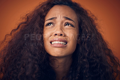 Buy stock photo Woman, crying and sad face in studio with anxiety, mental health problem and depression. Headshot of african female person on a brown background for cry emoji, psychology and broken heart with tears