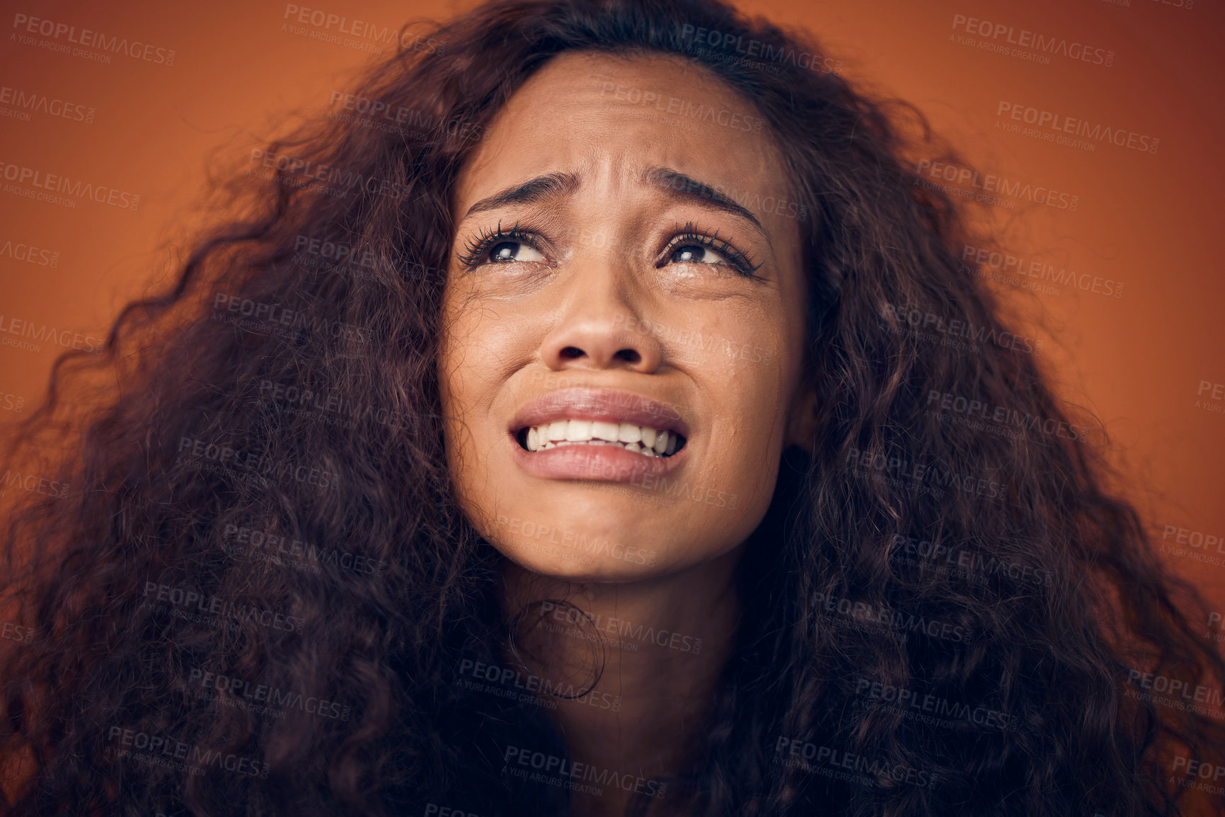 Buy stock photo Woman, crying and sad face in studio with anxiety, mental health problem and depression. Headshot of african female person on a brown background for cry emoji, psychology and broken heart with tears