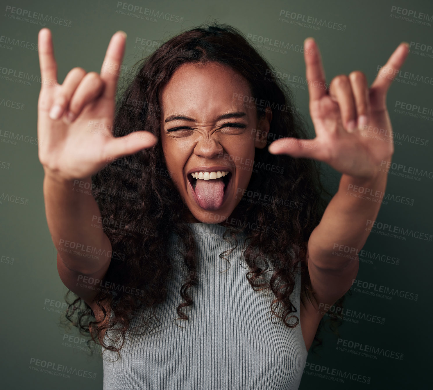Buy stock photo Female person, hand and rock in green studio background to celebrate with tongue in africa. Woman, rocker and sign with shouting and crazy expression for a party with excited youth for celebration. 