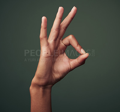 Buy stock photo Person hand, OK gesture and emoji with agreement, approval and feedback isolated on green background. Yes, like and thank you with mockup space, okay sign and expression of support closeup in studio