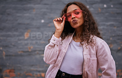 Buy stock photo African girl, sunglasses and thinking of fashion outdoor in cool style with accessory for holiday or vacation. Young person with pout, emoji and ideas or inspiration for clothes in heart shape shades