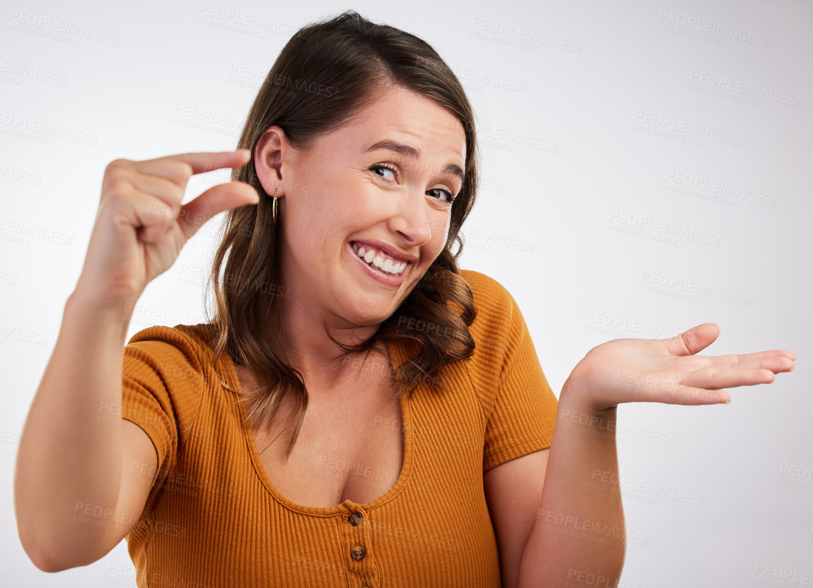 Buy stock photo Portrait, smile or woman with small hand palm space in studio for scale, comparison or measurement on white background. Unsure, face or model guess with finger gesture for emoji, doubt or mockup size