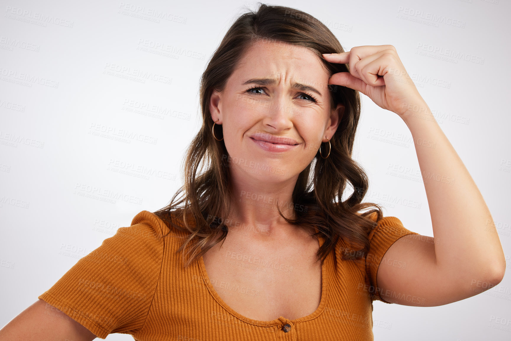 Buy stock photo Portrait, confused and frustrated woman with small hand sign in studio for scale, comparison or measurement on white background. Annoyed, face and angry model with tiny brain gesture, size or insult