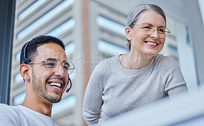 Buy stock photo Shot of a male businessman with his female boss in his office