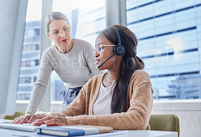 Buy stock photo Shot of a young businesswoman in her office with her senior manager