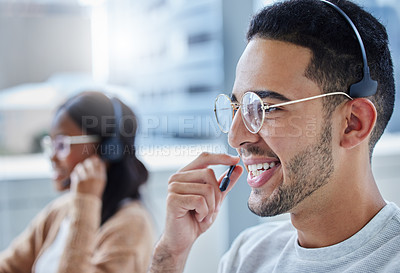 Buy stock photo Call center, face and smile with man in telemarketing office for assistance, communication or consulting. Contact, customer service and support with happy young telecom employee in workplace for help