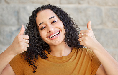 Buy stock photo Smile, thumbs up and portrait of woman for opinion, support or sign against wall. Happiness, hand gesture and face of gen z female person for achievement, like emoji and yes feedback in outdoor