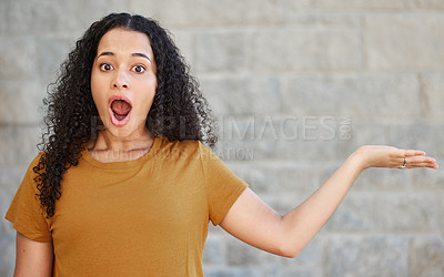 Buy stock photo Shot of a young woman holding out her hand