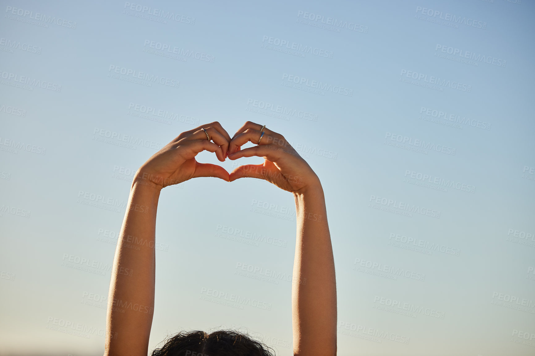 Buy stock photo Person, heart hands and sign for love on sky background, charity or donation with health or wellness outdoor. Emoji, feedback or vote with support, care and shape for romance with mockup space
