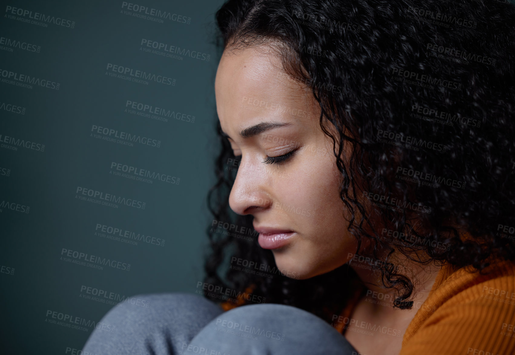 Buy stock photo Depressed, girl and sad with sorrow in studio, crying and unhappy with results of exam for diploma. Mental health, student and woman in green background, anxiety and stress  of scholarship in college