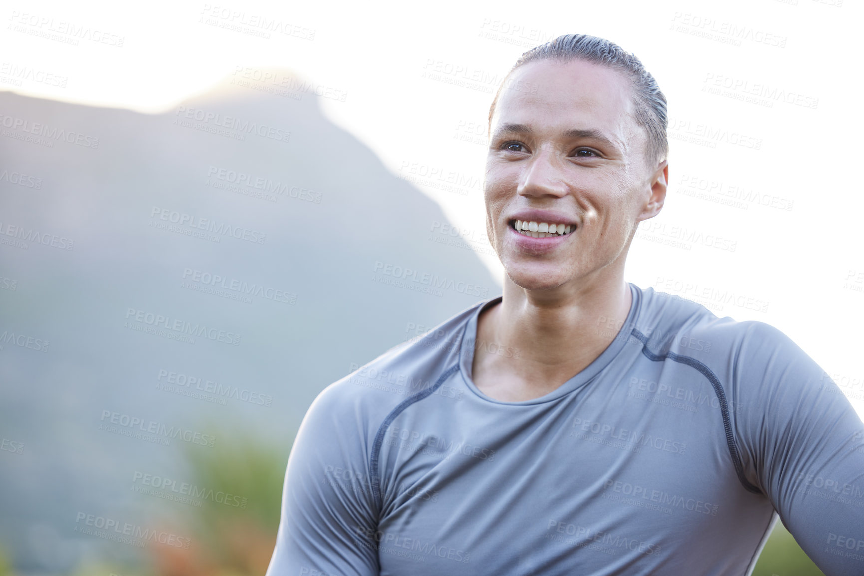 Buy stock photo Shot of a young man taking a break during his workout