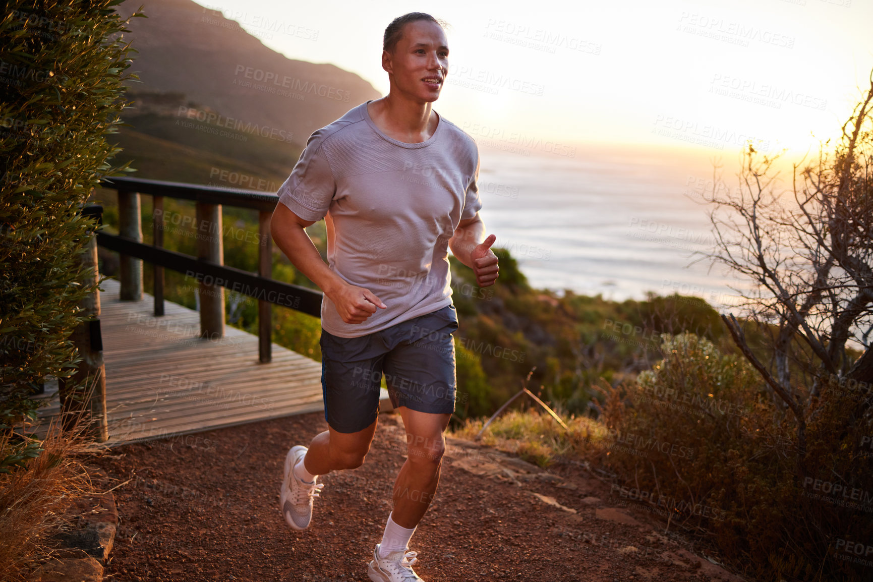 Buy stock photo Running, fitness and man in nature in morning for exercise, marathon training and workout. Sports, sunrise and male runner for warm up, cardio and outdoors for performance, wellness and health