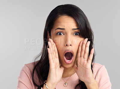 Buy stock photo Shot of a beautiful young woman shouting against a grey background