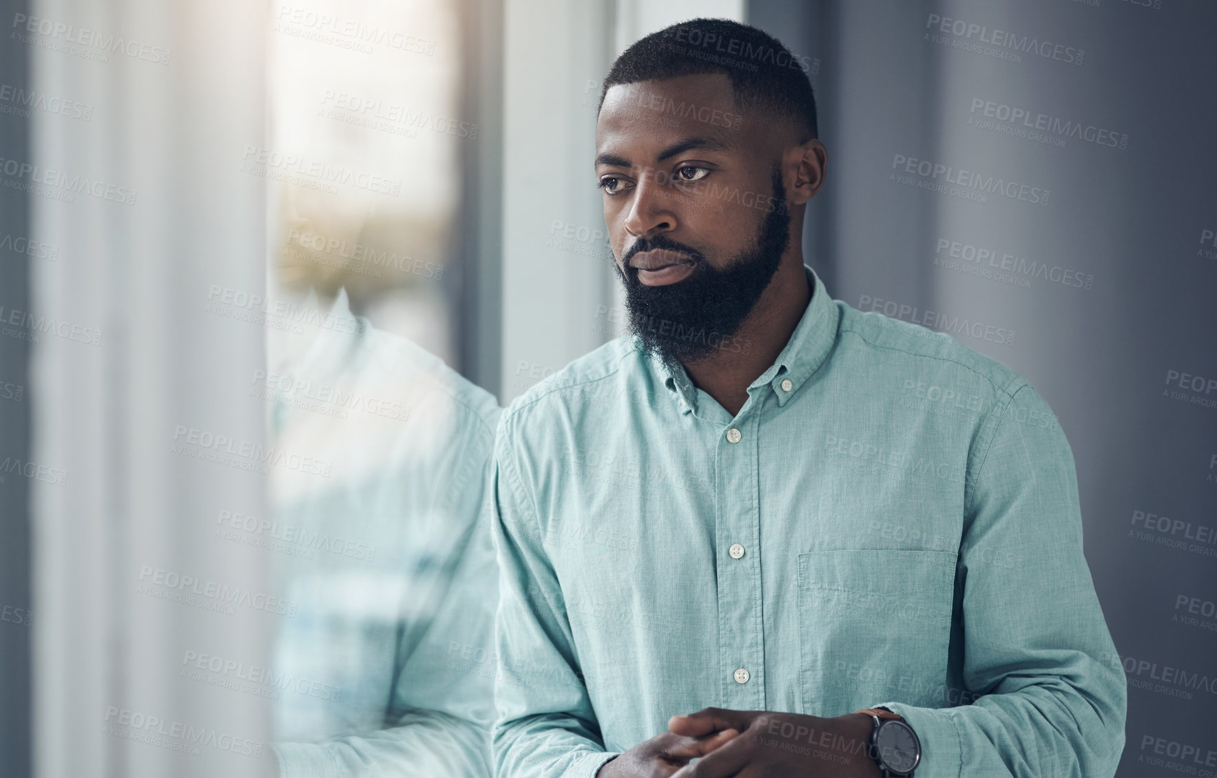 Buy stock photo Idea, window and a business black man thinking or planning in his professional office at work. Flare, problem solving and decision with a serious young male employee standing alone in the workplace