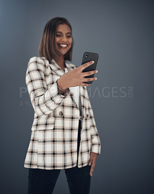 Buy stock photo Young business woman, selfie and smile by wall background with fashion, happiness and creativity on social media app. Indian businesswoman, photography and profile picture with pride, happy and blog