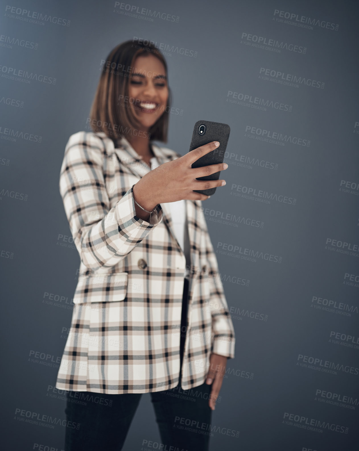 Buy stock photo Young business woman, selfie and smile by wall background with fashion, happiness and creativity on social media app. Indian businesswoman, photography and profile picture with pride, happy and blog