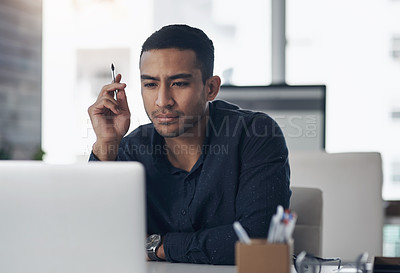 Buy stock photo Laptop, thinking and reading with a man journalist working in his office for editing a news report or article. Computer, idea and online with a young male editor at work in a modern journalism agency