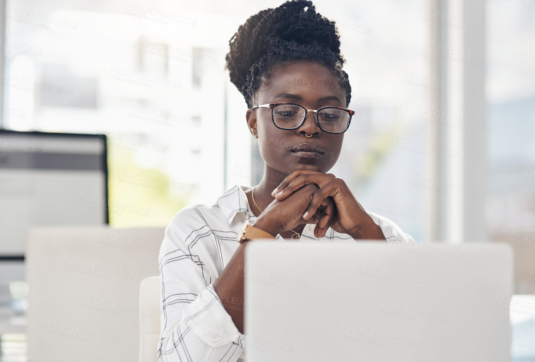 Buy stock photo Thinking, focus and african woman on laptop for solution, research and serious job decision or planning. Reading, review and choice of person or business analyst on computer for data problem solving