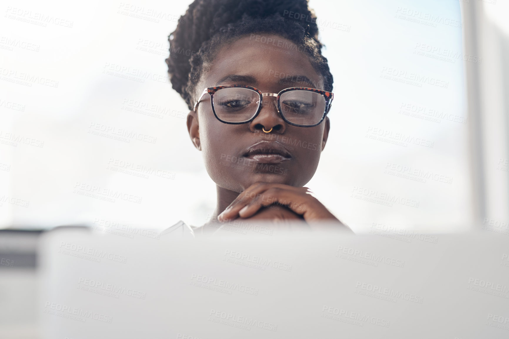 Buy stock photo Thinking, planning and business woman on computer for solution, research and serious, focus or job decision. Reading, review and choice of african person or analyst on laptop for data problem solving