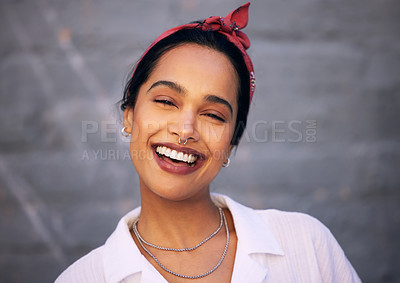 Buy stock photo Woman, portrait and smile with wall background in city with jewellery accessories, gen z or downtown. Female person, face and laughing for funny joke or urban traveling in Mexico, piercing or fashion