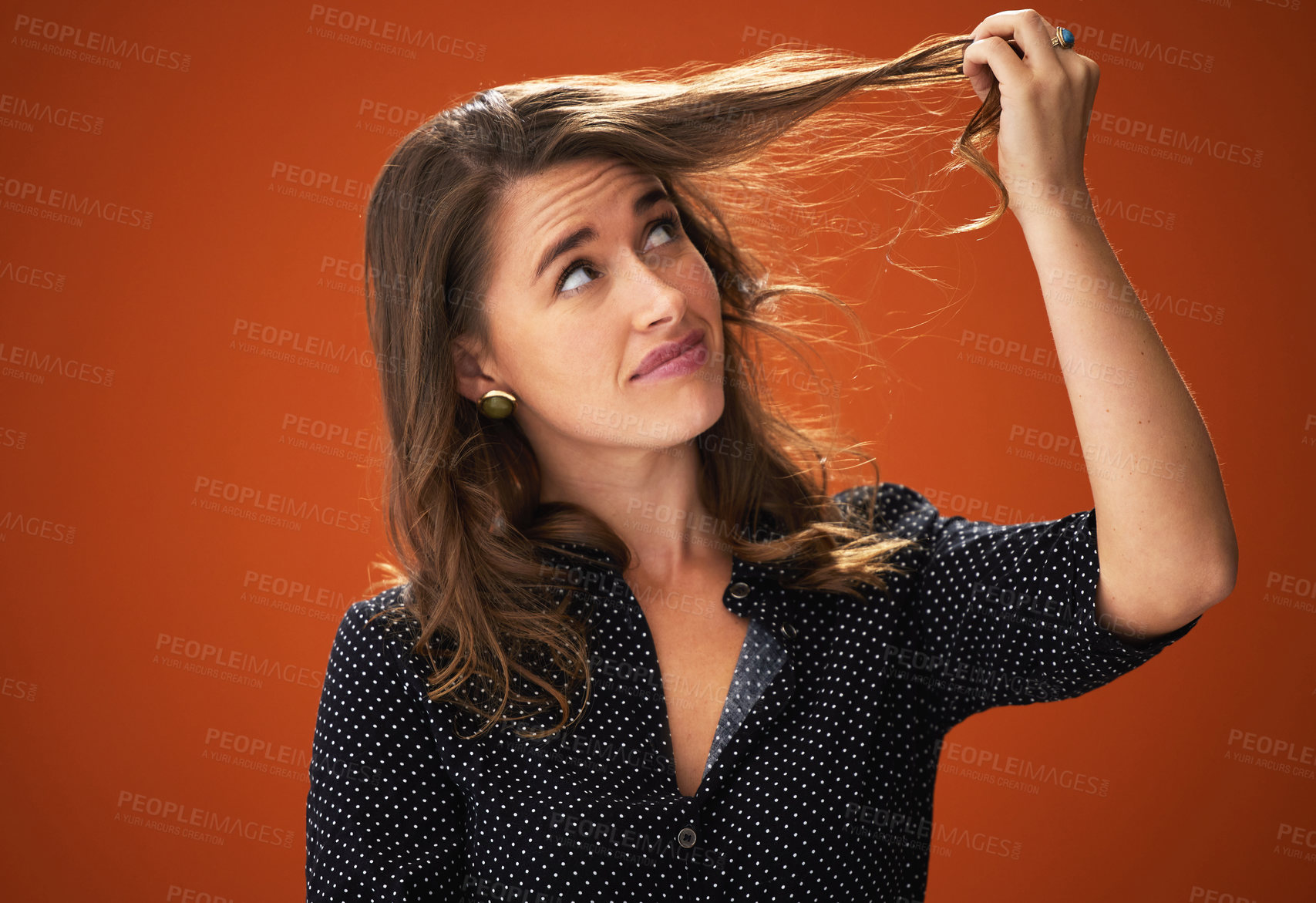 Buy stock photo Studio, sad and woman with hair loss, confused and unhappy with hairdo, entangled and frustration. Red background, mockup space and worry for haircare, damage and split end of hairstyle in salon