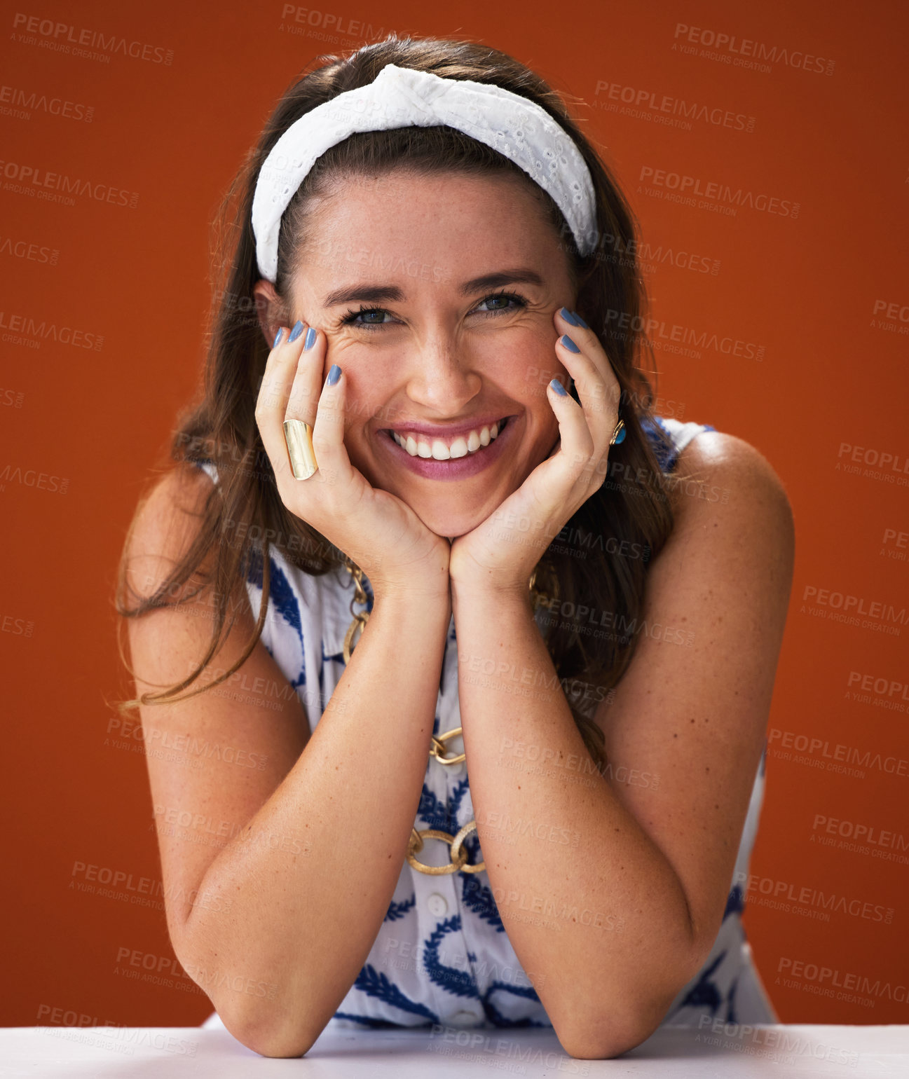 Buy stock photo Studio shot of a stylish young woman posing against a brown background