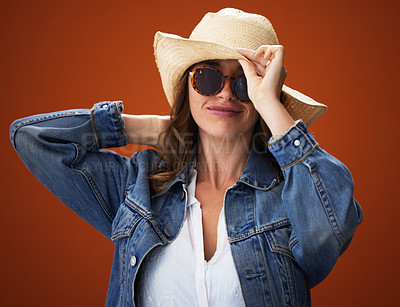 Buy stock photo Woman, hat and studio with portrait in sunglasses for fashion, trendy and outfit with style for inspiration. Background, denim and cool with glamour for self esteem with confidence for pride.