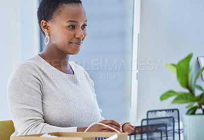 Buy stock photo Computer, smile and black woman in office for creative research with copywriting project. Technology, happy and professional African female writer typing email for content on desktop in workplace.