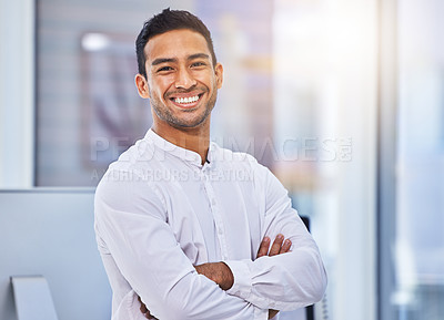 Buy stock photo Cropped shot of a young businessman standing in a modern office